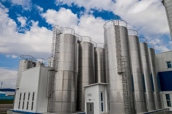 stainless steel tanks at a food processing plant top view.