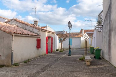 One small empty square in the old town of Saint-Trojan-les-Bains, taken on sunny winter day on Oleron Island, Charente, France