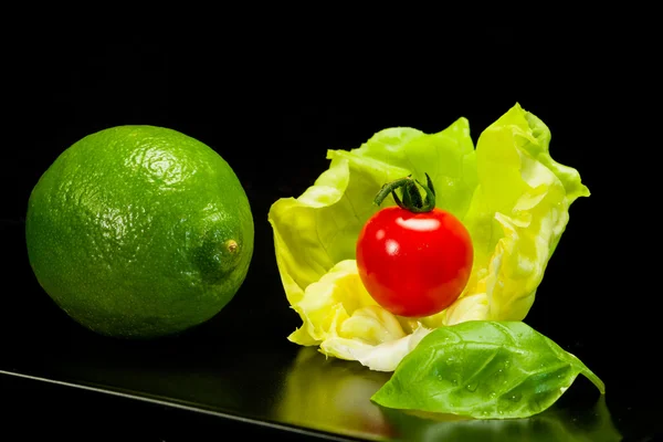 Lettuce, lime, basil  and tomato — Stock Photo, Image