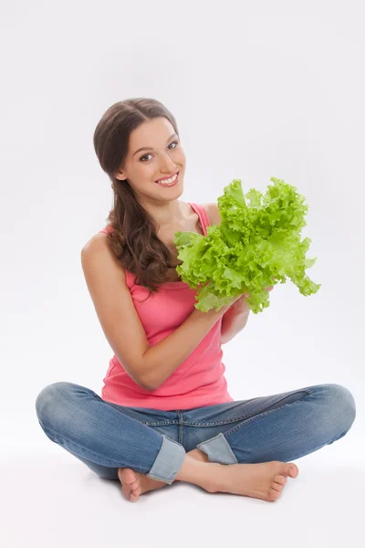 Beautiful girl with fresh lettuce on white — Stock Photo, Image