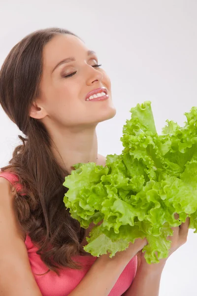 Beautiful girl with fresh lettuce on white — Stock Photo, Image