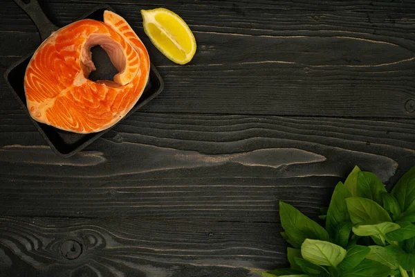 Salmon Steak Slices Lemon Basil Oil Wooden Surface Kitchen Table — Stock Photo, Image