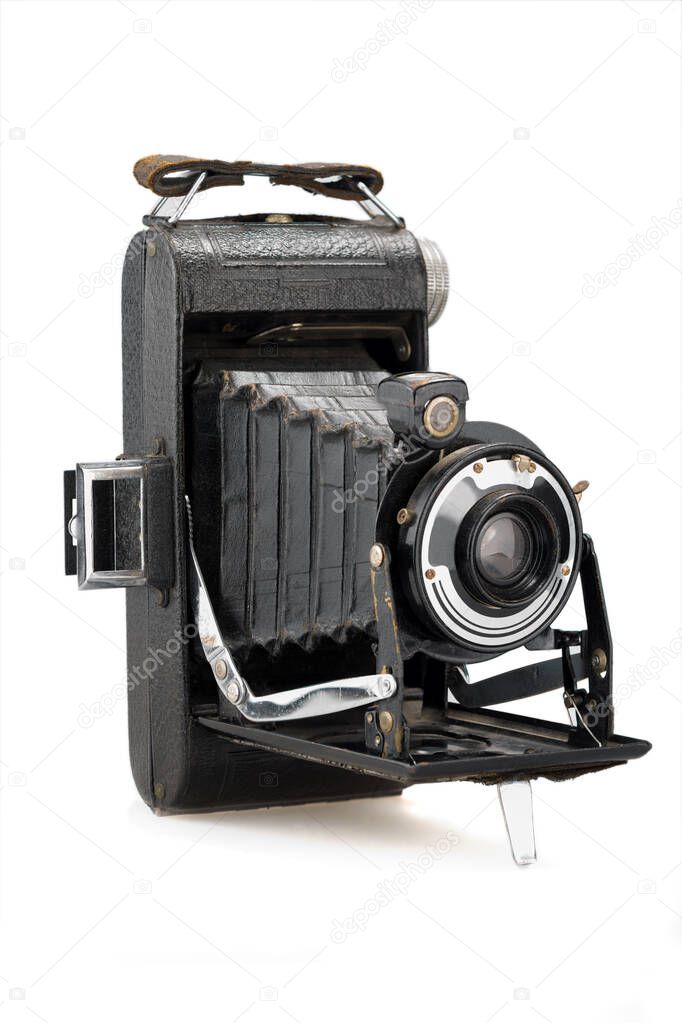 ancient folding camera on white background