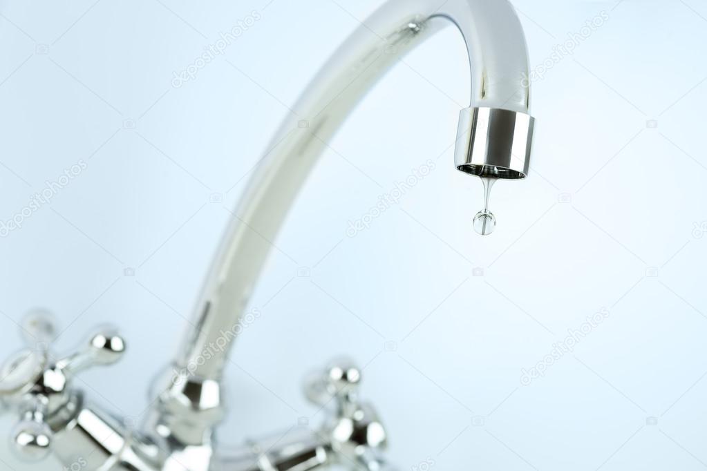 Tap and single drop of water