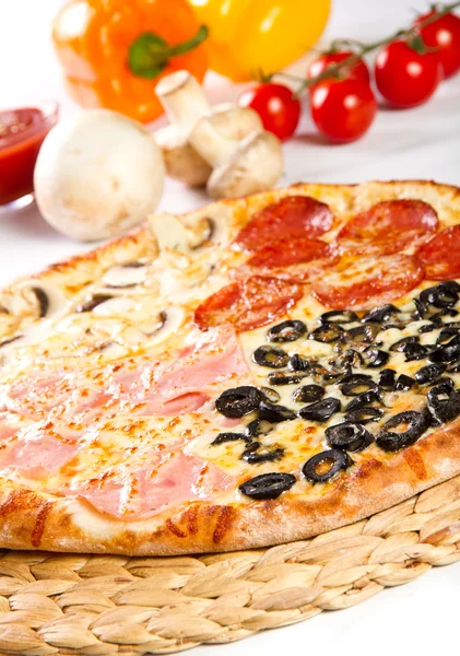 Pizza Quattro stagioni with salami, ham, olives and mushrooms — Stock Photo, Image