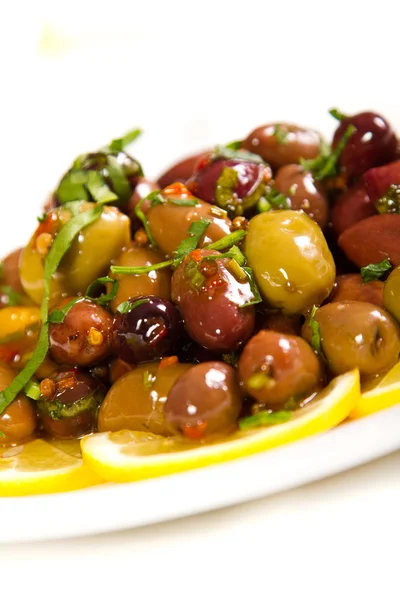Olives drizzled with olive oi — Stock Photo, Image