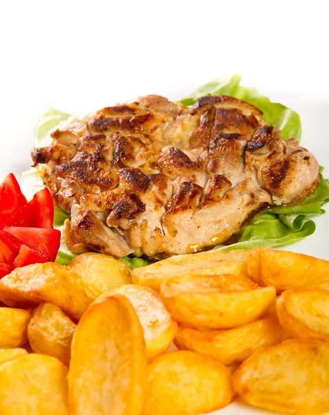 Grilled chicken thigh with potatos — Stock Photo, Image