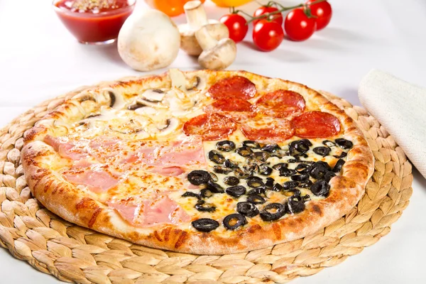 Pizza Quattro stagioni with salami, ham, olives and mushrooms — Stock Photo, Image