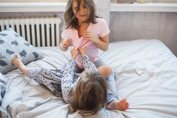 Room Decorated New Year Little Sisters Sitting Bed Playing Games — Stock Photo, Image