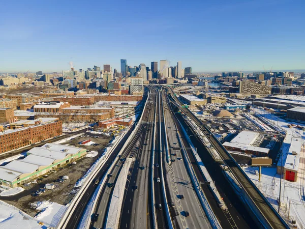 Boston downtown modern city skyline and Interstate Highway 93 in winter aerial view, Boston, Massachusetts MA, USA.