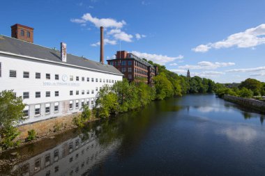 Historic Wilkinson Mill building in Old Slater Mill National Historic Landmark on Roosevelt Avenue in downtown Pawtucket, Rhode Island RI, USA.