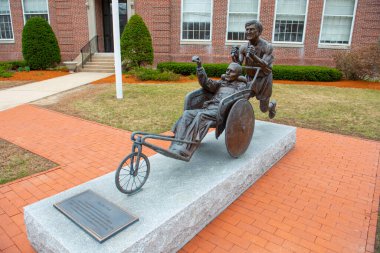 Boston Marathon Yes You Can statue in downtown Hopkinton near Start Line on Main Street in town of Hopkinton, Massachusetts, USA.