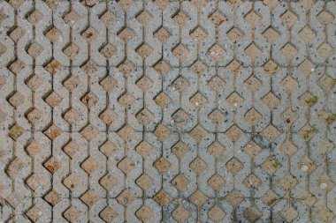 Kum ve eski beton kaldırım desenli arka plan. Tuğla solucan tabanı deseni, yukarıdan görüntüle ve uzayı kopyala, seçmeli odak.