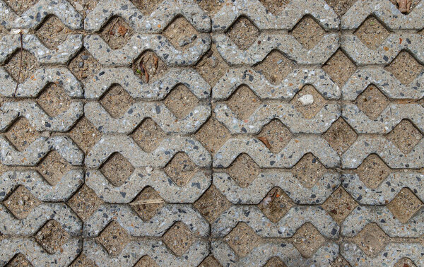 Sand and old concrete block pavement pattern texture background. Pattern of brick worm floor, View from above and Copy space, Selective focus.