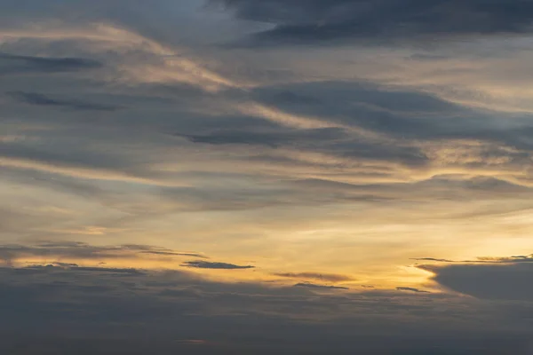 The sun shines through the clouds in the sky.  The shape of the clouds evokes imagination and creativity. They can be used as wallpapers that look amazing. Copy space, No focus, specifically.