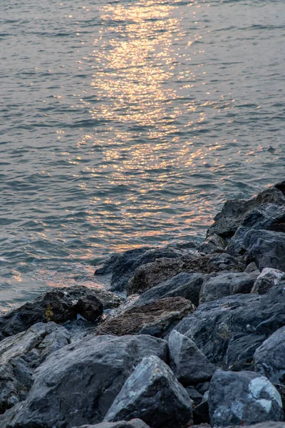 Rocks and sea : View of sea waves hitting rocks on the Calm beach in the morning. No focus, specifically.