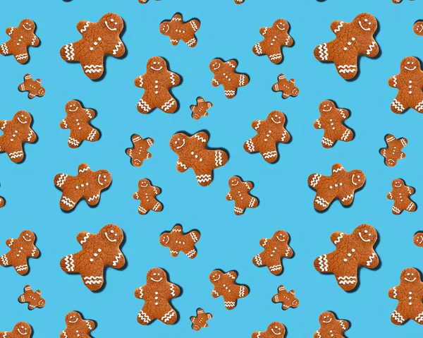 Seamless pattern gingerbread man on a blue background.Gingerbread man pattern. Holiday decoration. Festive ornament. — Stock Photo, Image
