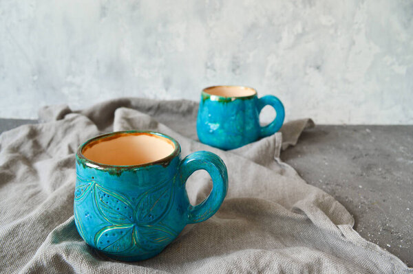 Clay cups handmade in blue. Ecology concept. For mulled wine, chai masala.