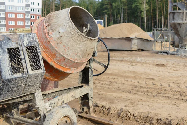 Industrial concrete mixer at a construction site. Preparation of concrete and mortar