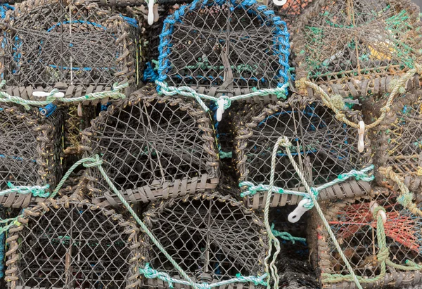 Lobster or crab pots stacked on jetty — Stock Photo, Image