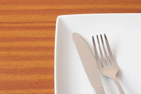 White place setting on wooden table — Stock Photo, Image