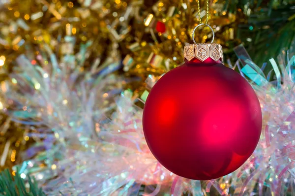 Christmas red bauble with tinsel — Stock Photo, Image