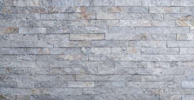 Duvardaki gri dekoratif taşı kapat.
