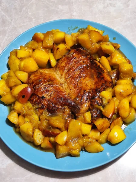 Thanksgiving traditional dinner. Backed chicken with apples and mango. Autumn feast.