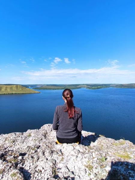 Woman is relaxing on mountain at Dnister river, Ukraine Stock Picture