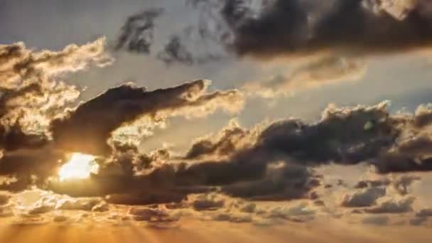 Timelapse movie of clouds at sunset above the sea — Stock Video