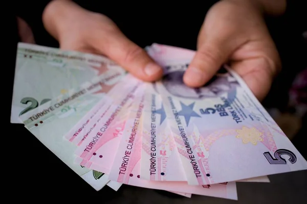 Concept Hand Holding Money Front Black Background — Stock Photo, Image