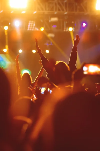 Black silhouette of young girl on rock concert — Stock Photo, Image