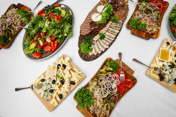 stock image Table full of tasty snacks, meat, cheese and vegetable plate