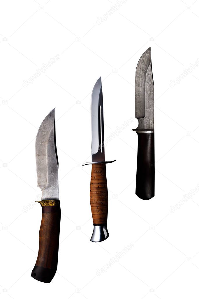 Set of knifes made of Damascus steel with a wooden handle on a isolated white background.