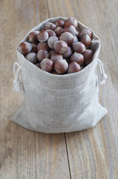 Hazelnuts in a cotton bag.