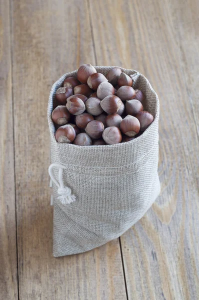 Hazelnuts in a cotton bag. — Stock Photo, Image