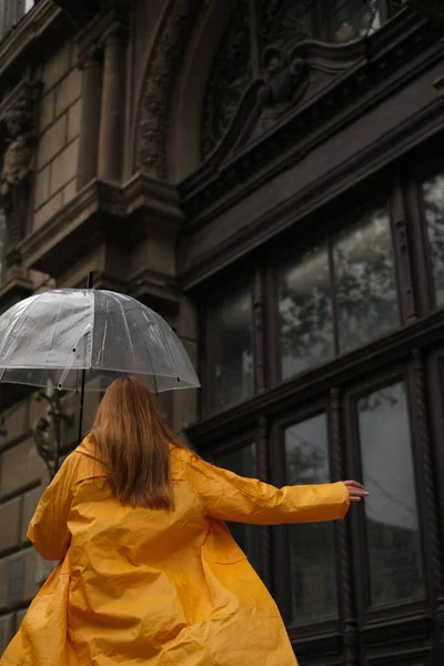 Beautiful Woman Yellow Raincoat Walks City Transparent Umbrella Rain — Stock Photo, Image