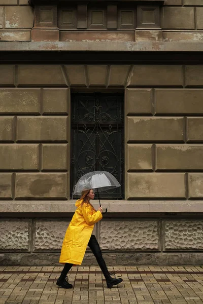 Beautiful Woman Yellow Raincoat Walks City Transparent Umbrella Rain — Stock Photo, Image