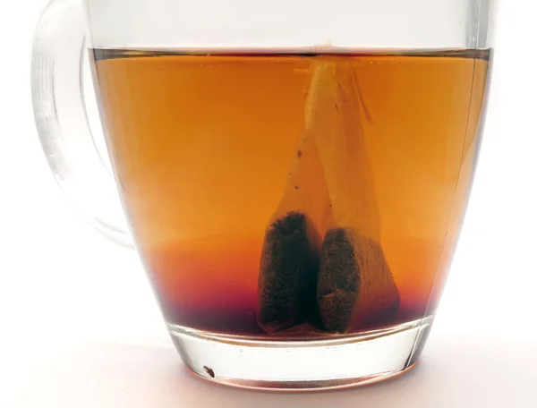 Teabag steeping in tea — Stock Photo, Image