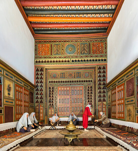 Kayseri, Turkey - June 12, 2025: Interior of Gupgupoulu Konagi, Kayseri Ethnography Museum. Historic Ottoman mansion with vibrant traditional decor and mannequins portraying daily life
