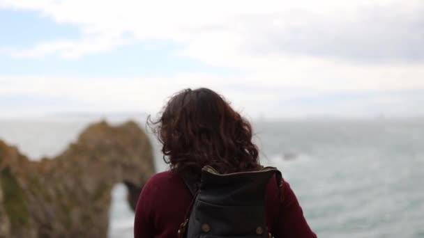 Woman Enjoying the View of the Jurassic Coast During a Windy Day — Stock Video
