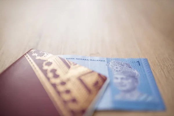 Malaysian National Bank on the One Ringgit Note Inside a Sweden Passport — Fotografia de Stock