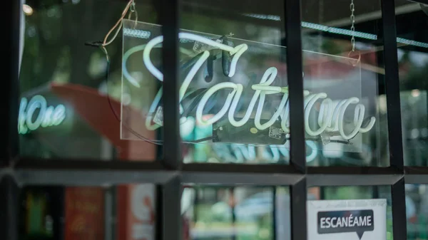 Blue Tattoo Light Sign from a Barber Shop and Tattoo Studio — Stock Fotó