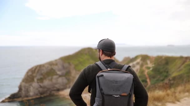 Man Enjoying the View of the Jurassic Coast During a Windy Day — Stock Video