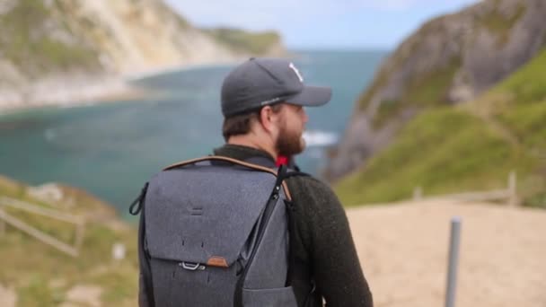 Man With his Baby Enjoys the View of the Jurassic Coast — Stock Video