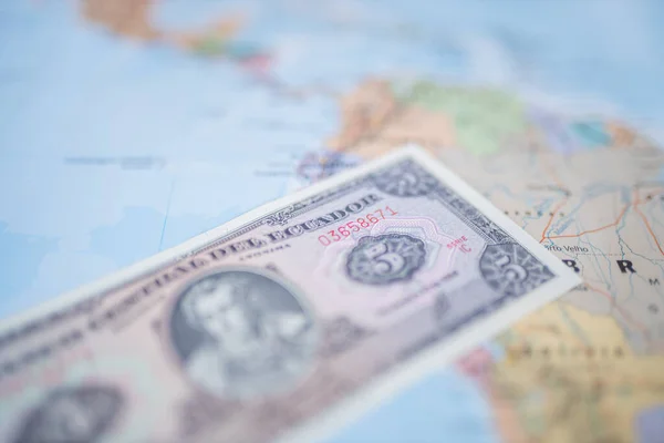 Five Sucres Bill on Top of a Blurry and Colorful South American Map — Stockfoto