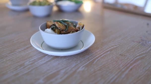 Tasty Vegetarian Dishes Served in White Bowls and on a Wooden Table — Stock video