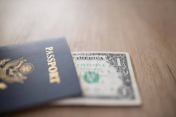 One-Dollar Bill Under a United States of America Passport — Foto de Stock
