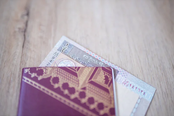 Kuwait Quarter Dinar Partially Inside a Sweden Passport — Stockfoto