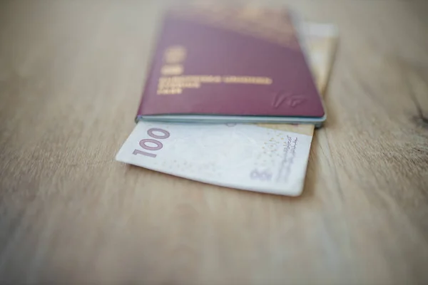 100 Moroccan Dirhams Bill Partially Inside a Sweden Passport — Stockfoto